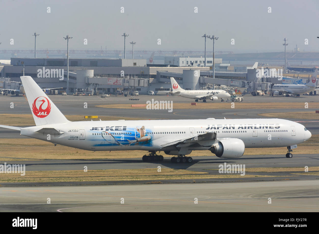 Japan Airlines (JAL) aircraft JET-KEI on the tarmac at Tokyo International Airport on March 4, 2016, Tokyo, Japan. The special aircraft JET-KEI (JL043) made its inaugural flight sending off Japanese National Tennis team including star player Kei Nishikori, whose image is featured on the Boeing 777-300ER craft, from Haneda to London Heathrow for the upcoming Davis Cup beginning March 4th. © Rodrigo Reyes Marin/AFLO/Alamy Live News Stock Photo