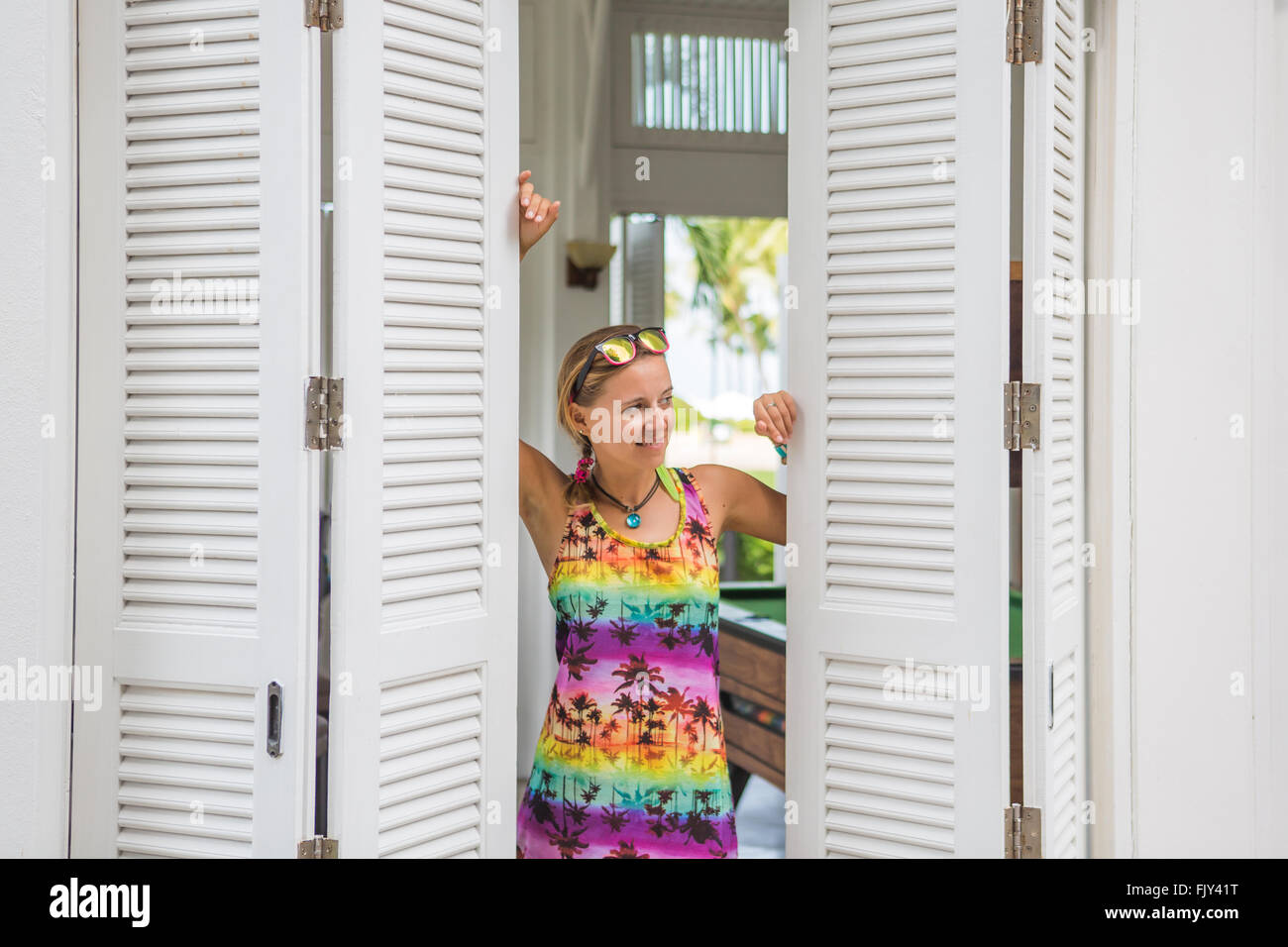 Modern young woman in doorway Stock Photo - Alamy