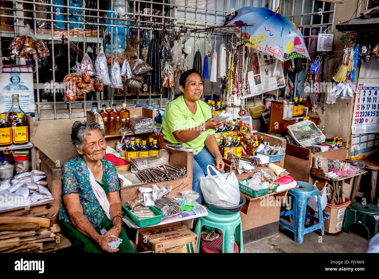 Philippines Negros Dumaguete Vendors at the shrine outside Dumaguete cathedral  Adrian Baker Stock Photo