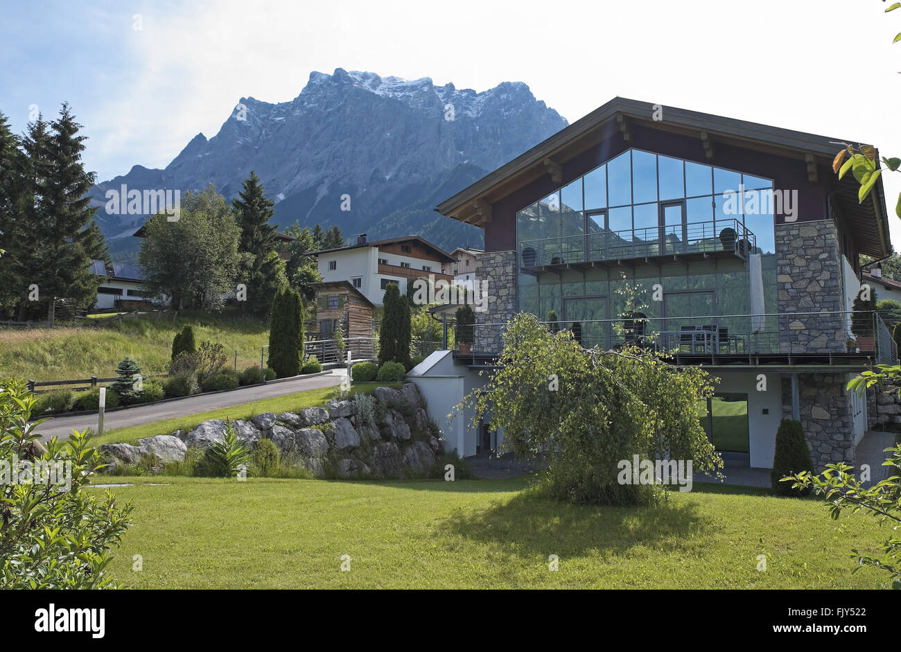 Zugspitze massif seen from the west over a modern house, Ehrwald