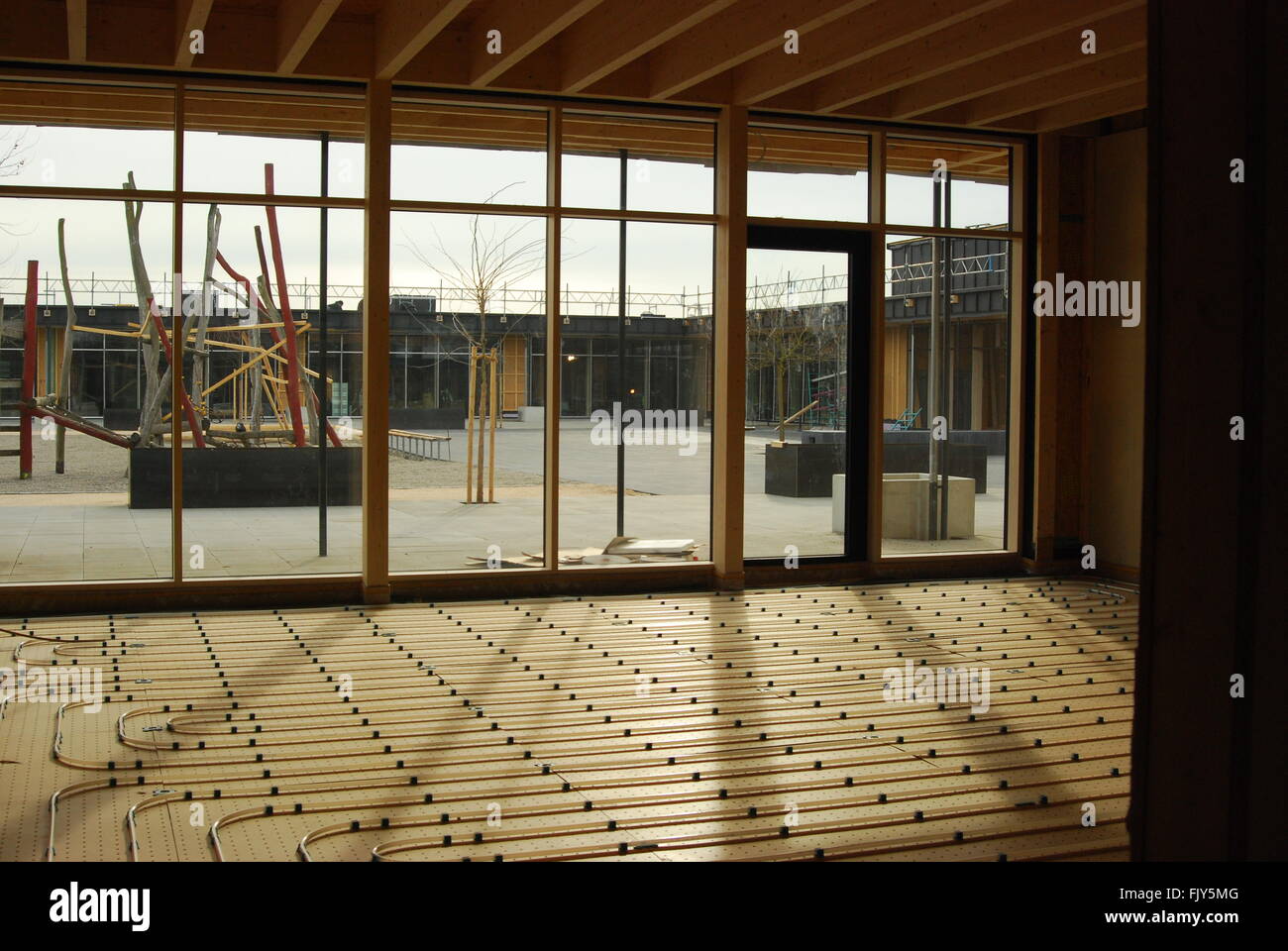 View of heating coils and school playground in a construction site Stock Photo