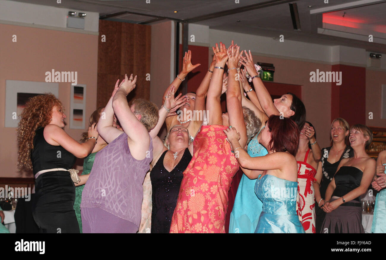 ladies catching the bouquet