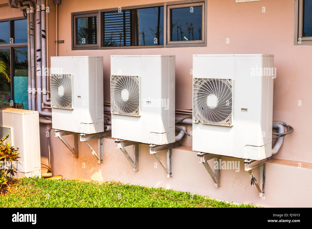 air conditioner compressor units near building Stock Photo