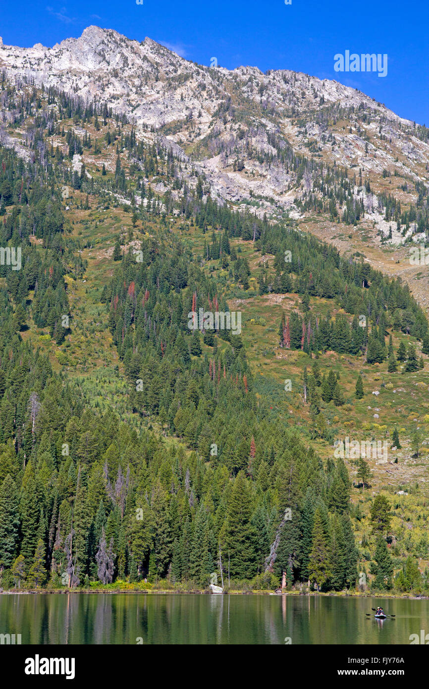 Canoeing in Jenny Lake, below the Teton Range Stock Photo Alamy
