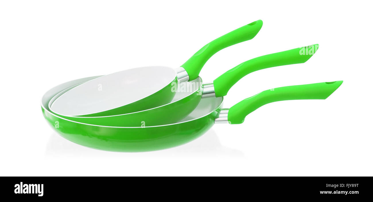 Set of three frying pans, isolated, close-up, green Stock Photo