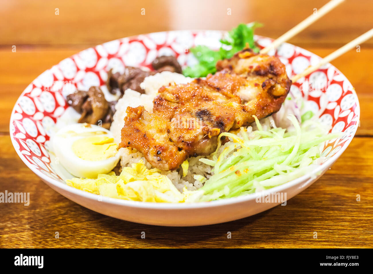 Rice Mixed with Shrimp paste and chicken grill In restaurant Stock Photo