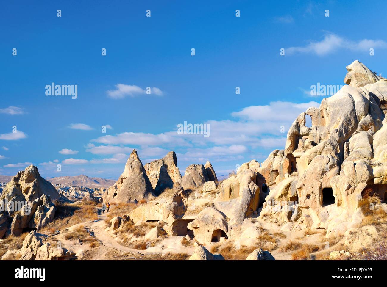 Eroded volcanic tuff early Christian troglodyte cave dwelling rooms in Goreme Open Air Museum National Park, Cappadocia, Turkey Stock Photo