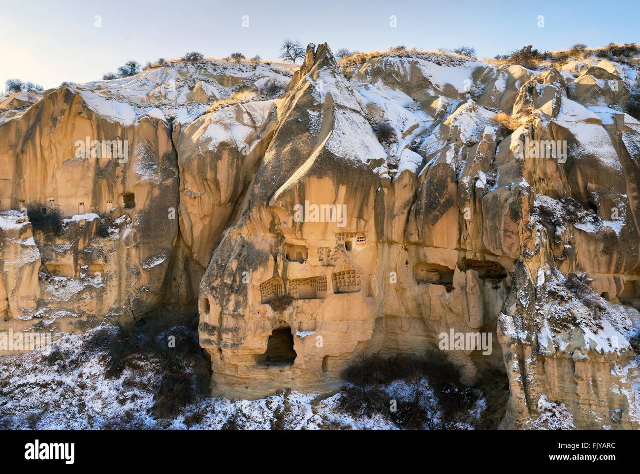Eroded volcanic tuff early Christian troglodyte cave dwelling rooms in Goreme Open Air Museum National Park, Cappadocia, Turkey Stock Photo