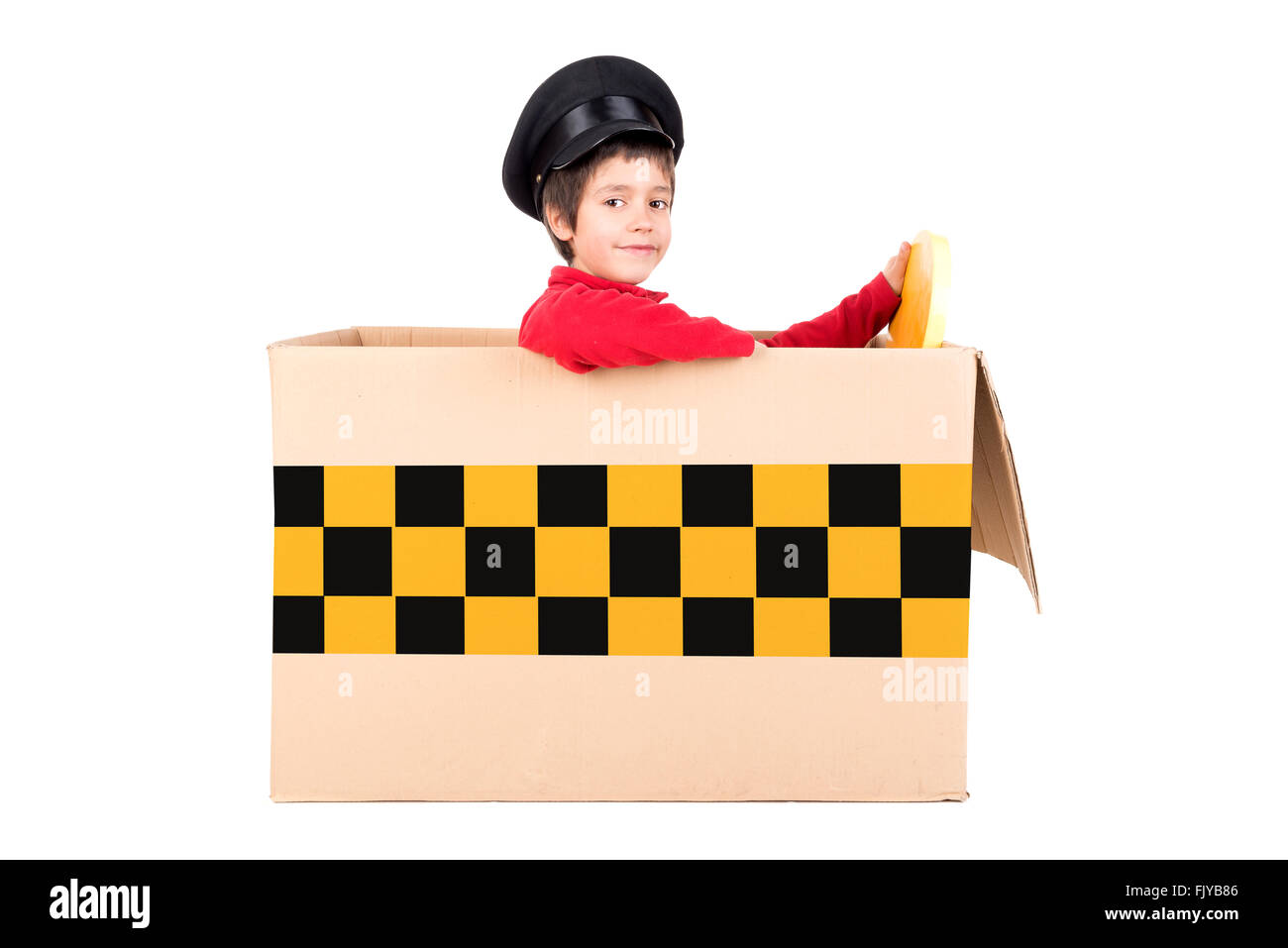 Young boy in a cardboard box playing taxi driver Stock Photo