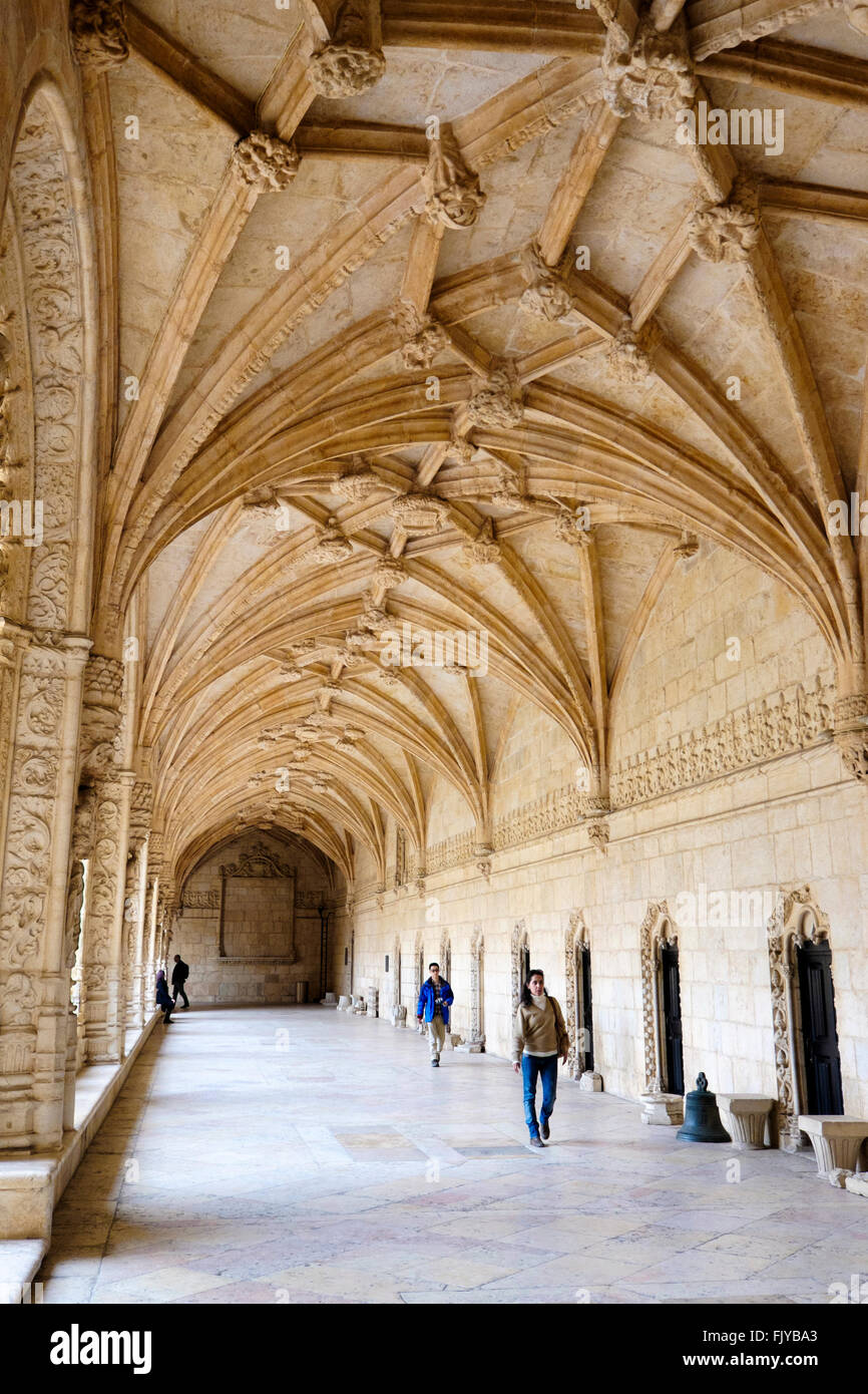 Portugal, Lisbon: Tourists in the medieval cloister of Jeronimos Monastery in Belém Stock Photo