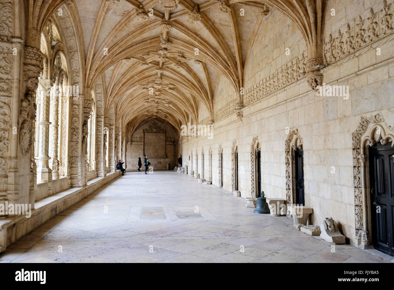 Portugal, Lisbon: Tourists in the medieval cloister of Jeronimos Monastery in Belém Stock Photo