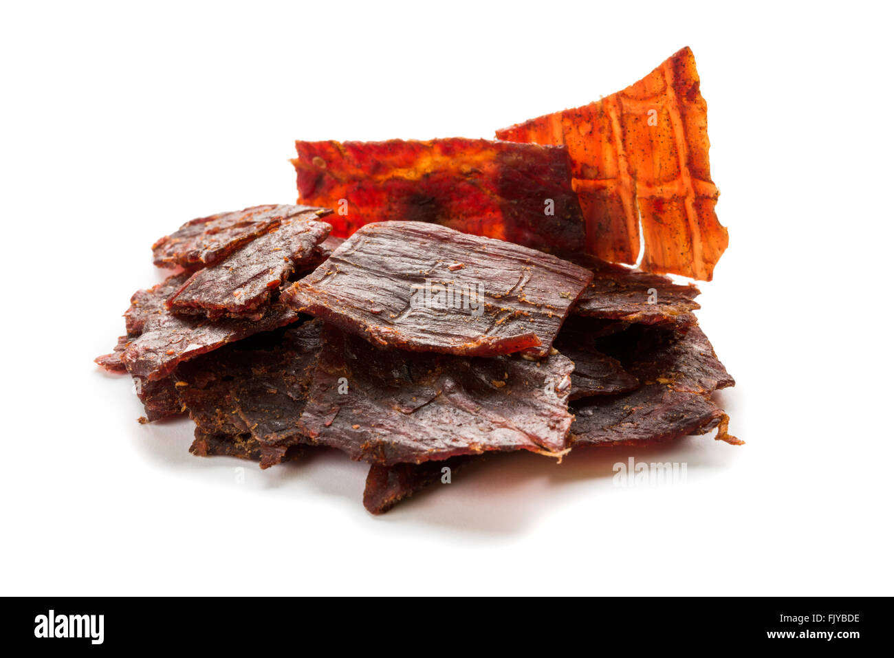 Close-up shot of beef jerky portion isolated on white background Stock ...