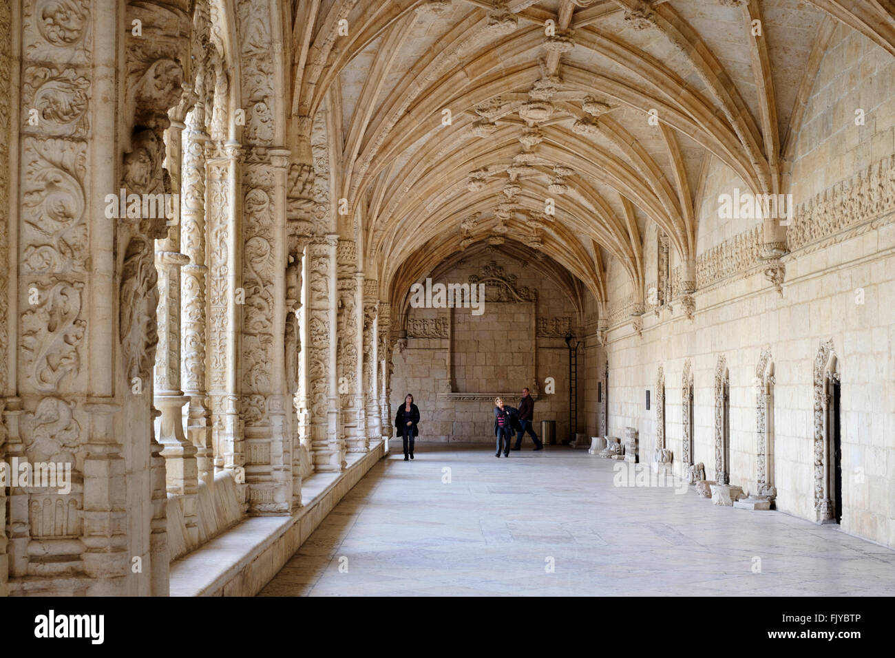 Portugal, Lisbon: Tourists in the medieval cloister of Jeronimos Monastery in Belém Stock Photo