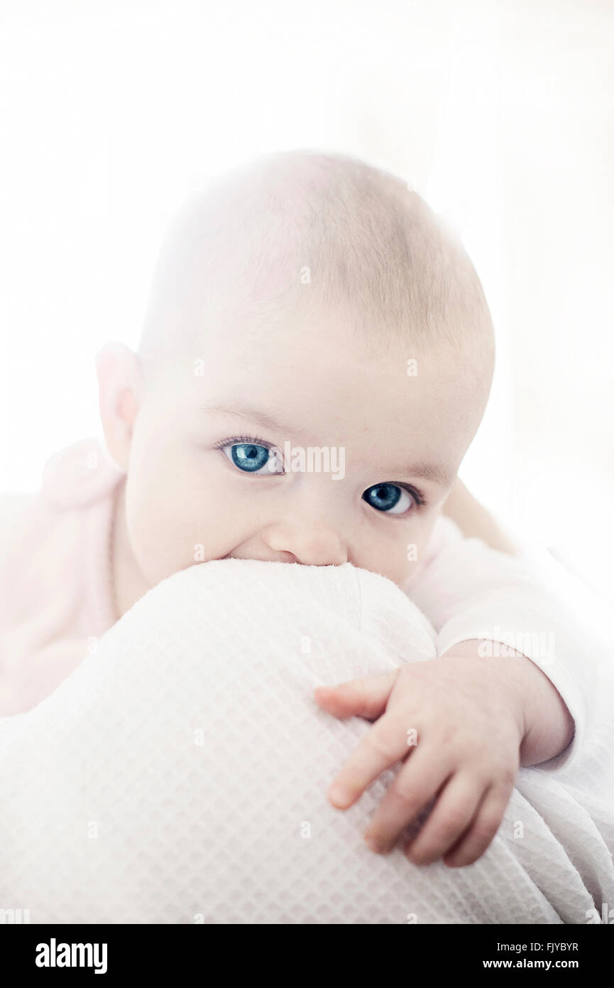 beautiful baby girl in her mother's arms Stock Photo