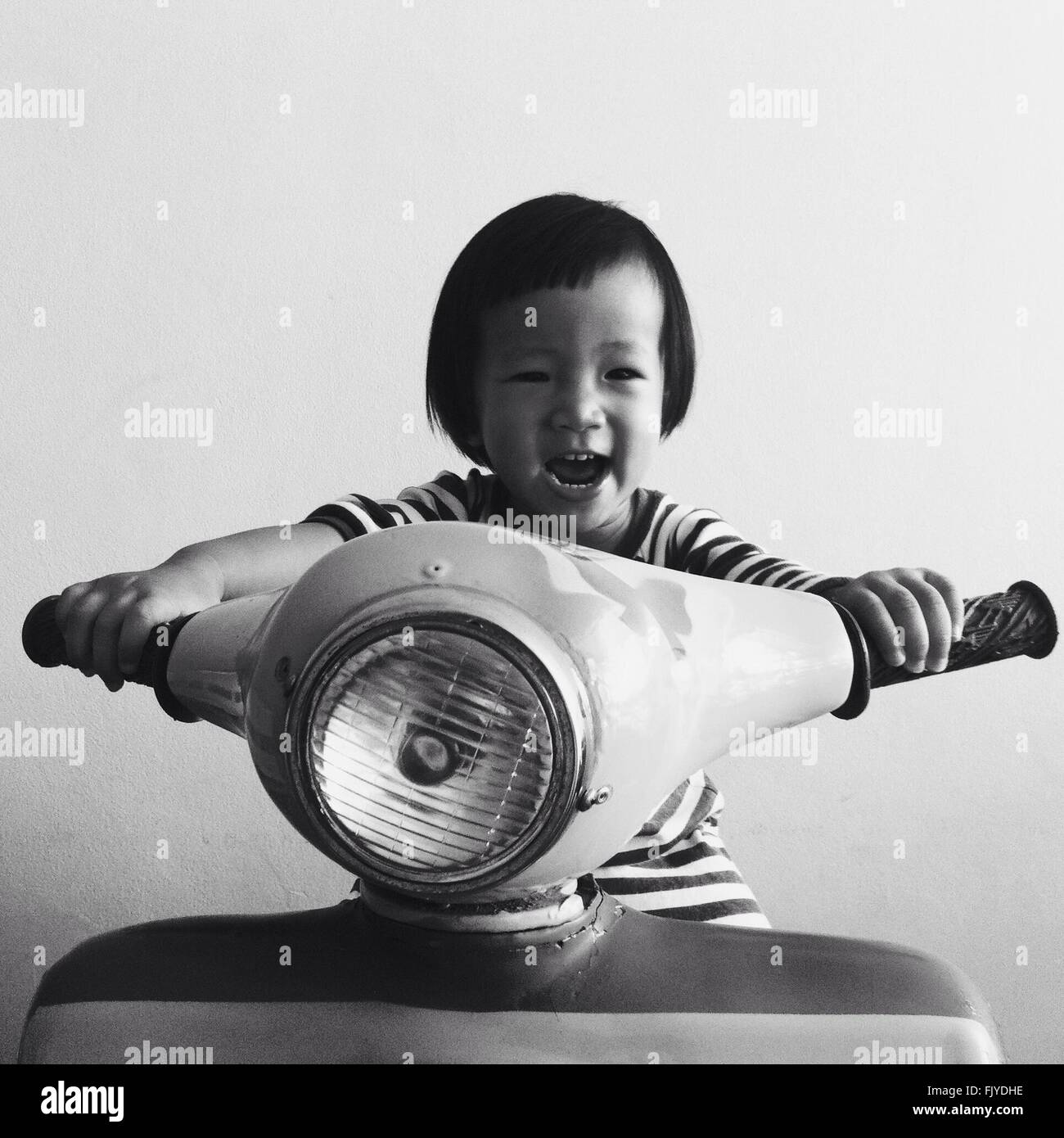 Boy Playing With A Scooter Stock Photo