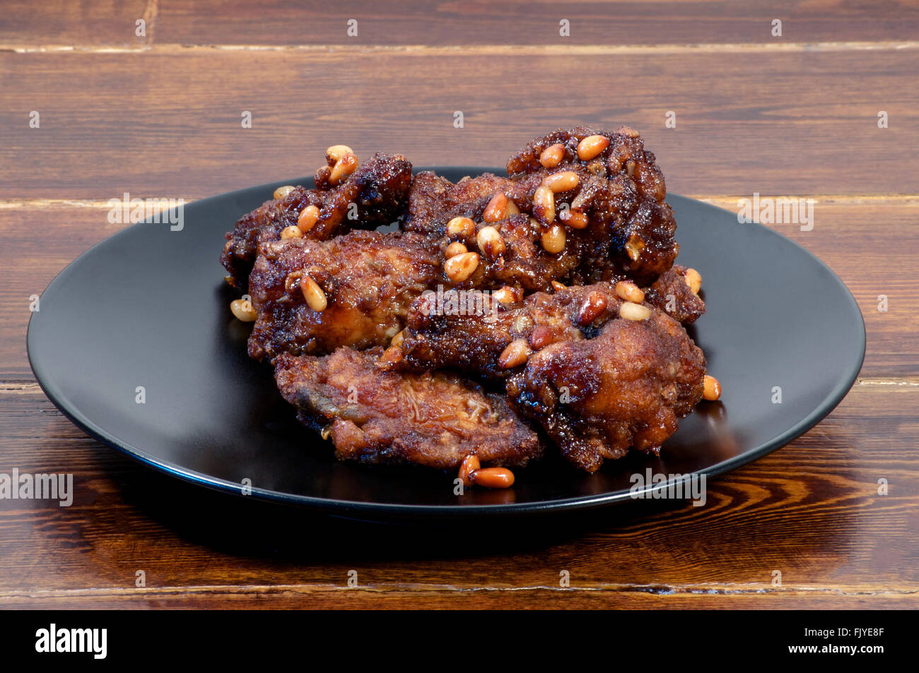 Korean glazed chicken wings over wooden background Stock Photo Alamy