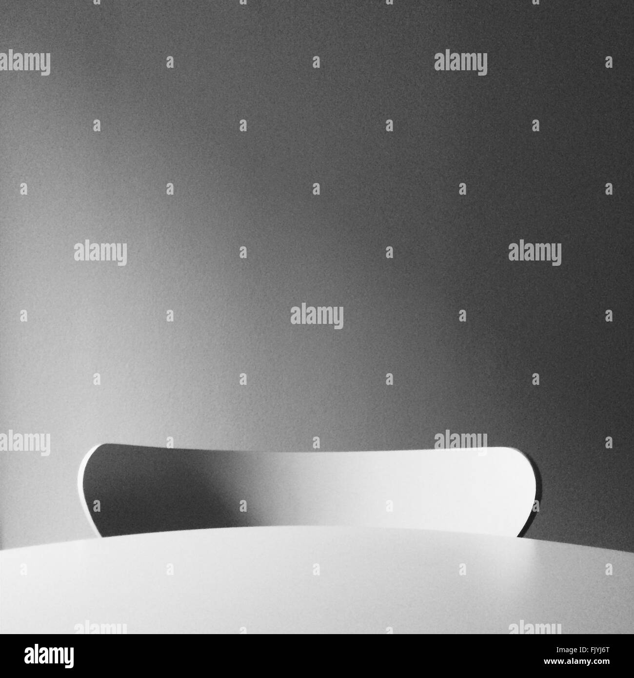 Close-Up Of Table With Empty Chair Stock Photo - Alamy