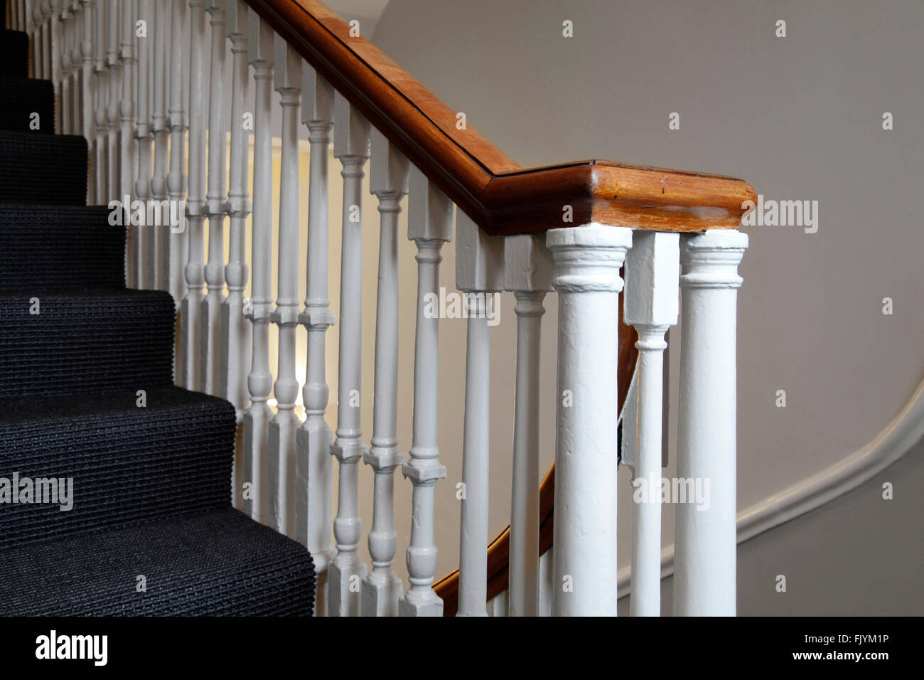 Edgar House Bath Furnished rental apartments in a Georgian building on George Street Bath The bannisters on the staircase with Stock Photo