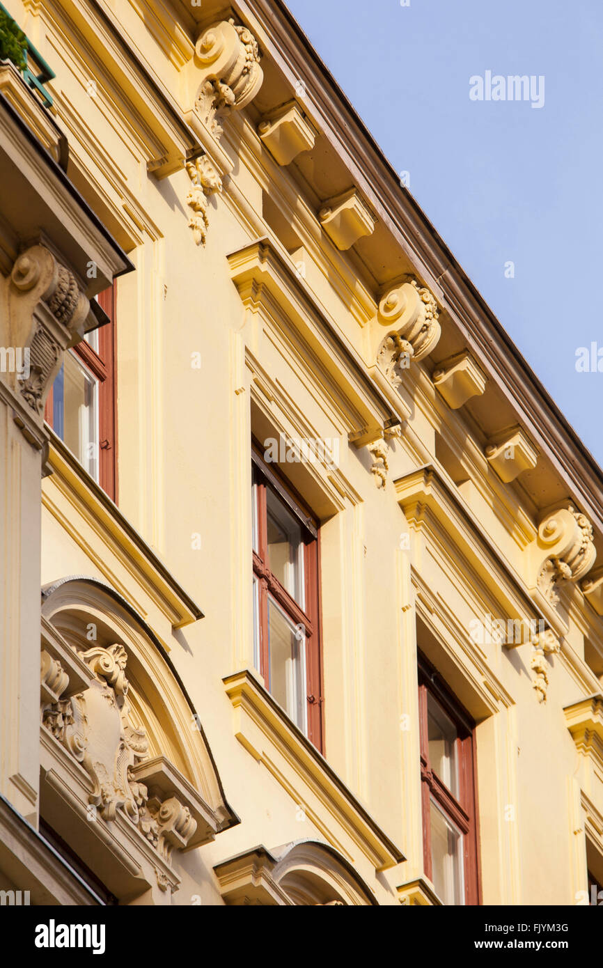 Rental properties in Berlin. Historic terraced houses in a street with decorative plasterwork. Stock Photo