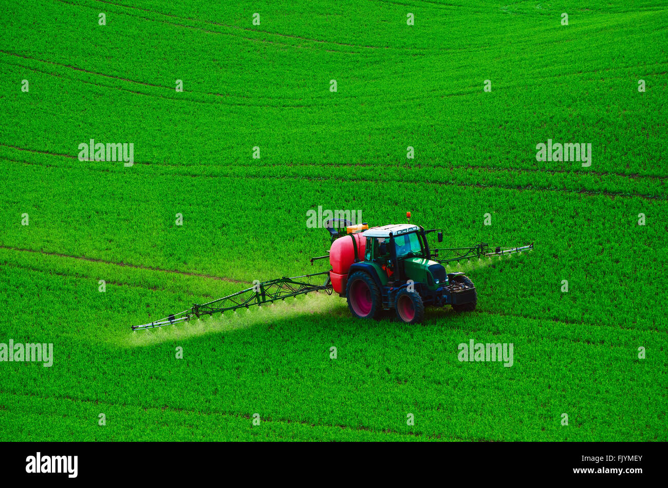 Farm machinery spraying insecticide Stock Photo - Alamy
