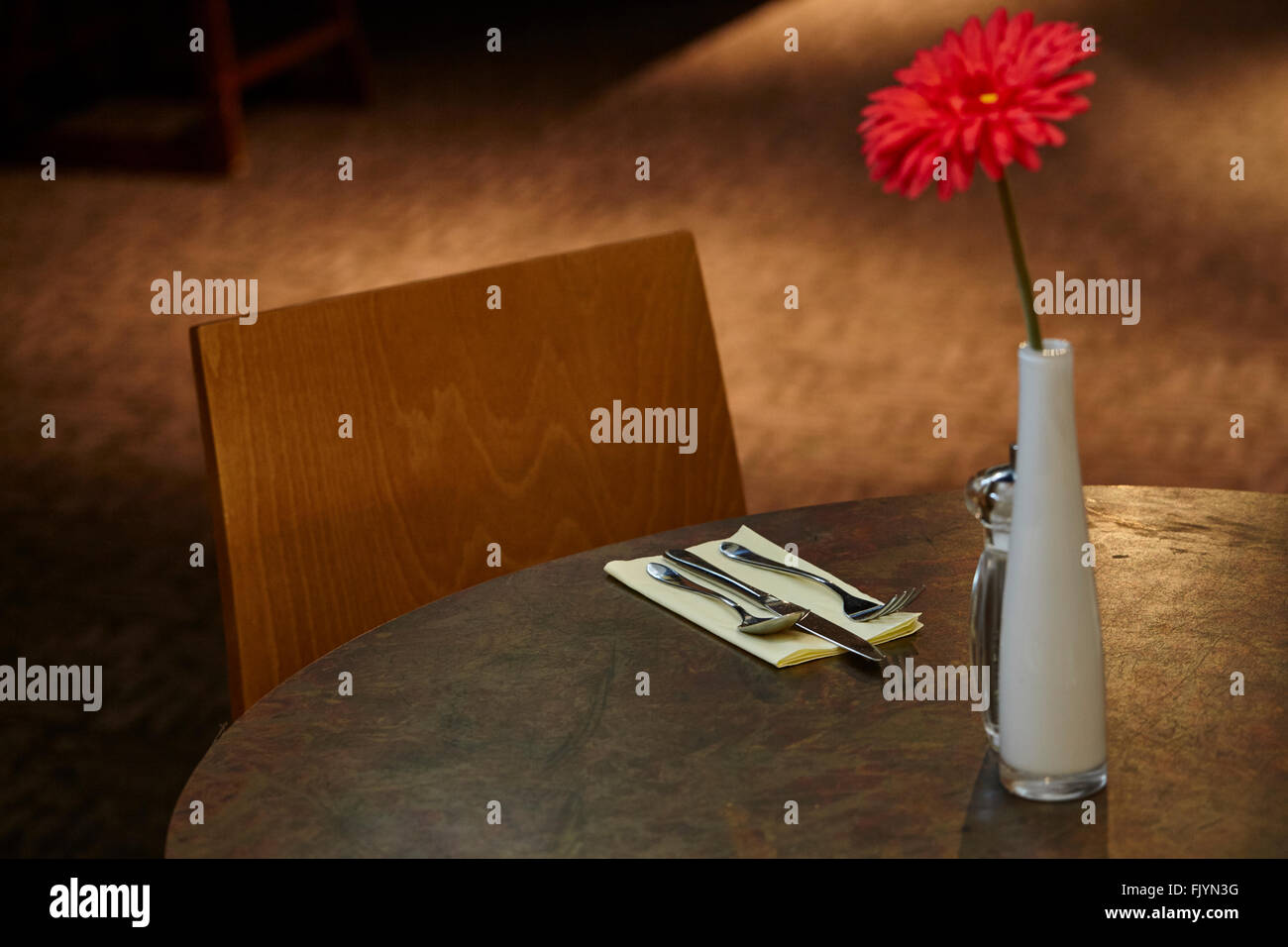 restaurant table with red flower Stock Photo