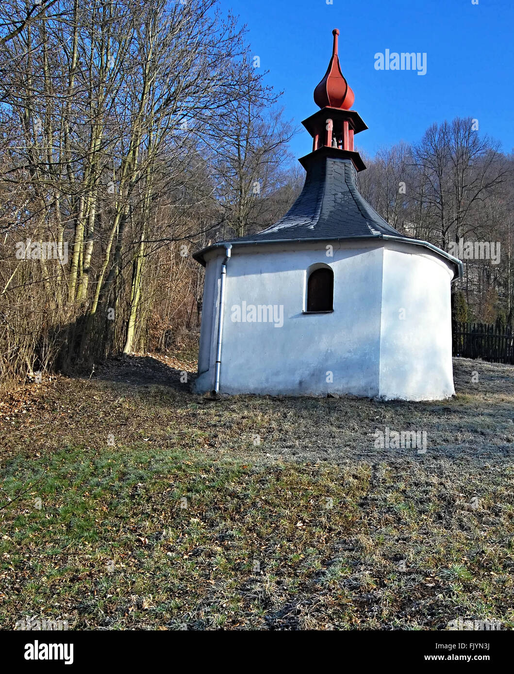 small chapel with trees around and clear sky in Podhradi (parto of Vitkov city) Stock Photo