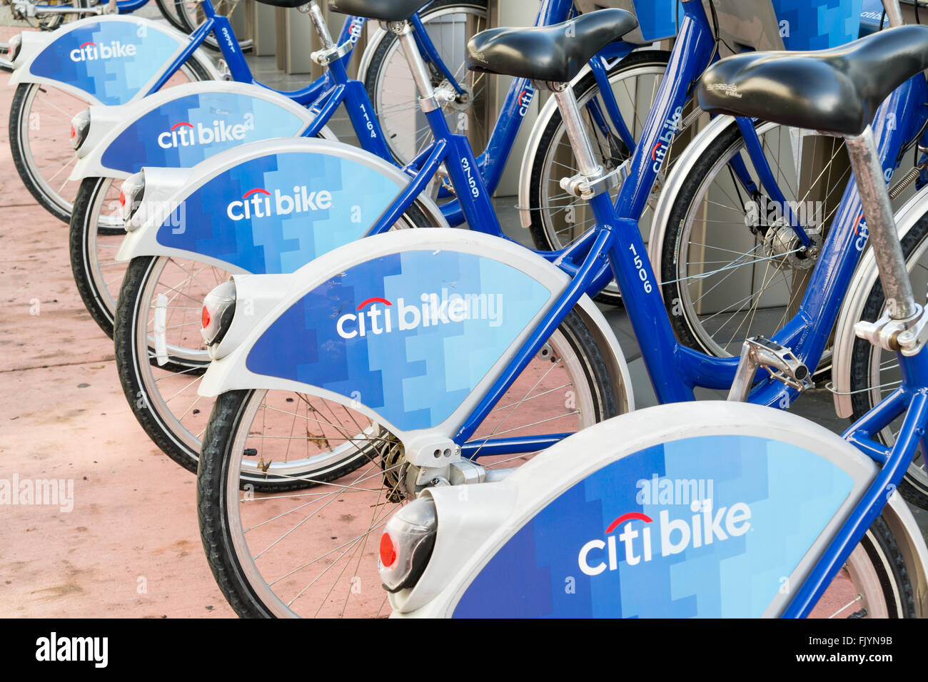 Bicycles parked in a row at city bike station in South Beach district of Miami Beach, Florida, USA Stock Photo