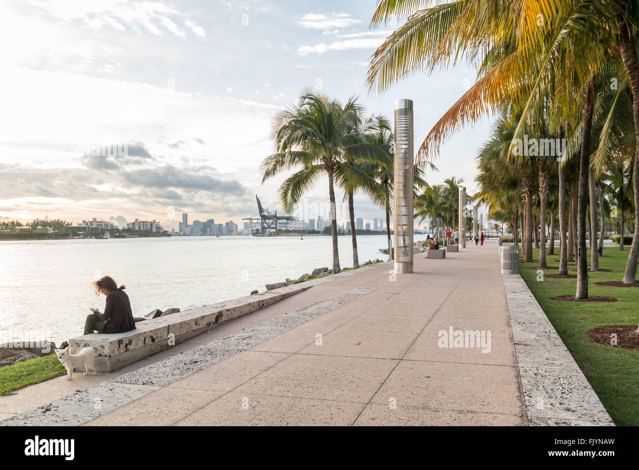 Waterfront promenade with people and harbour view,  South Pointe Park in South Beach district of Miami Beach, Florida, USA Stock Photo