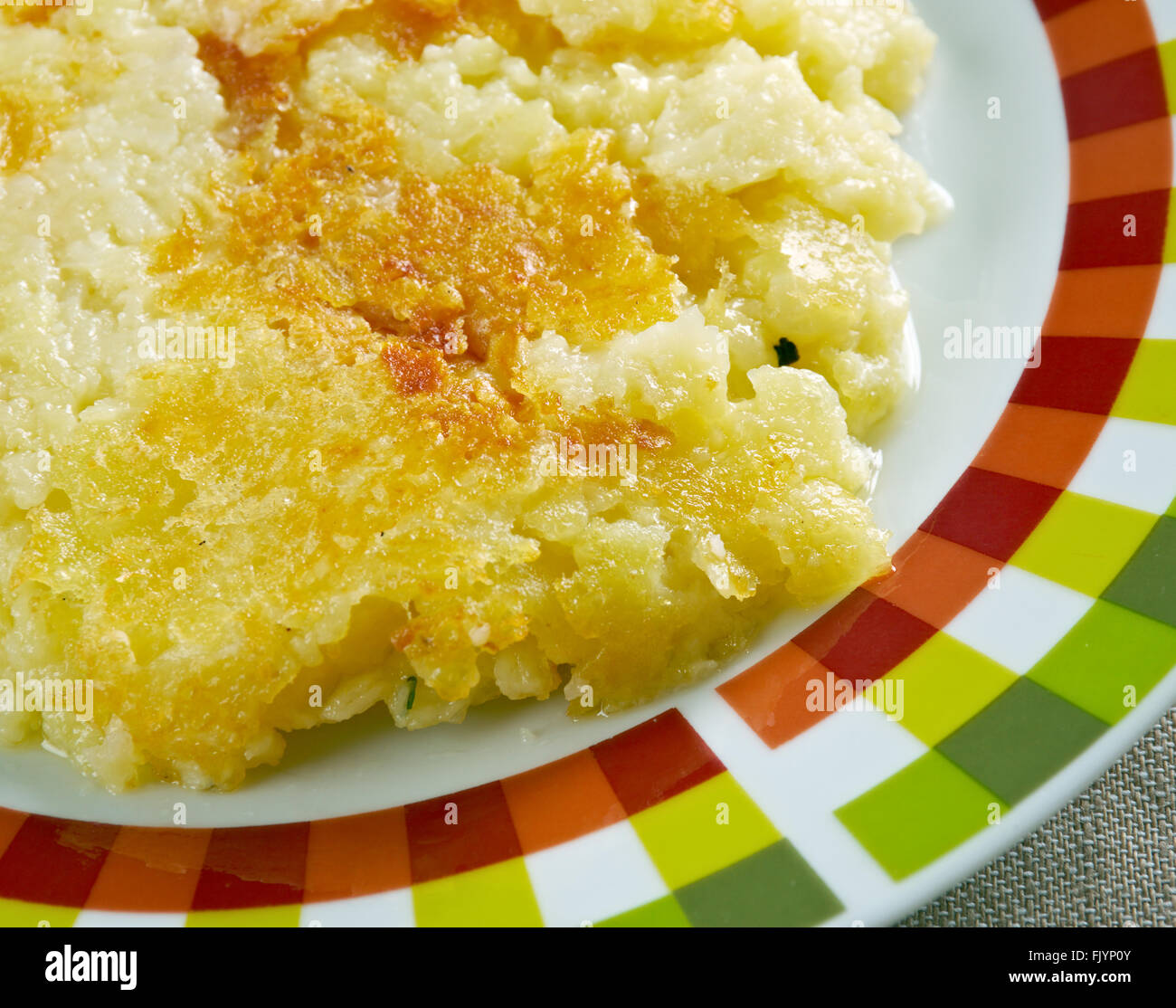 Frico con patate e cipolla.Italian dish with potatoes and cheese typical of my region the Friuli Venezia Giulia Stock Photo