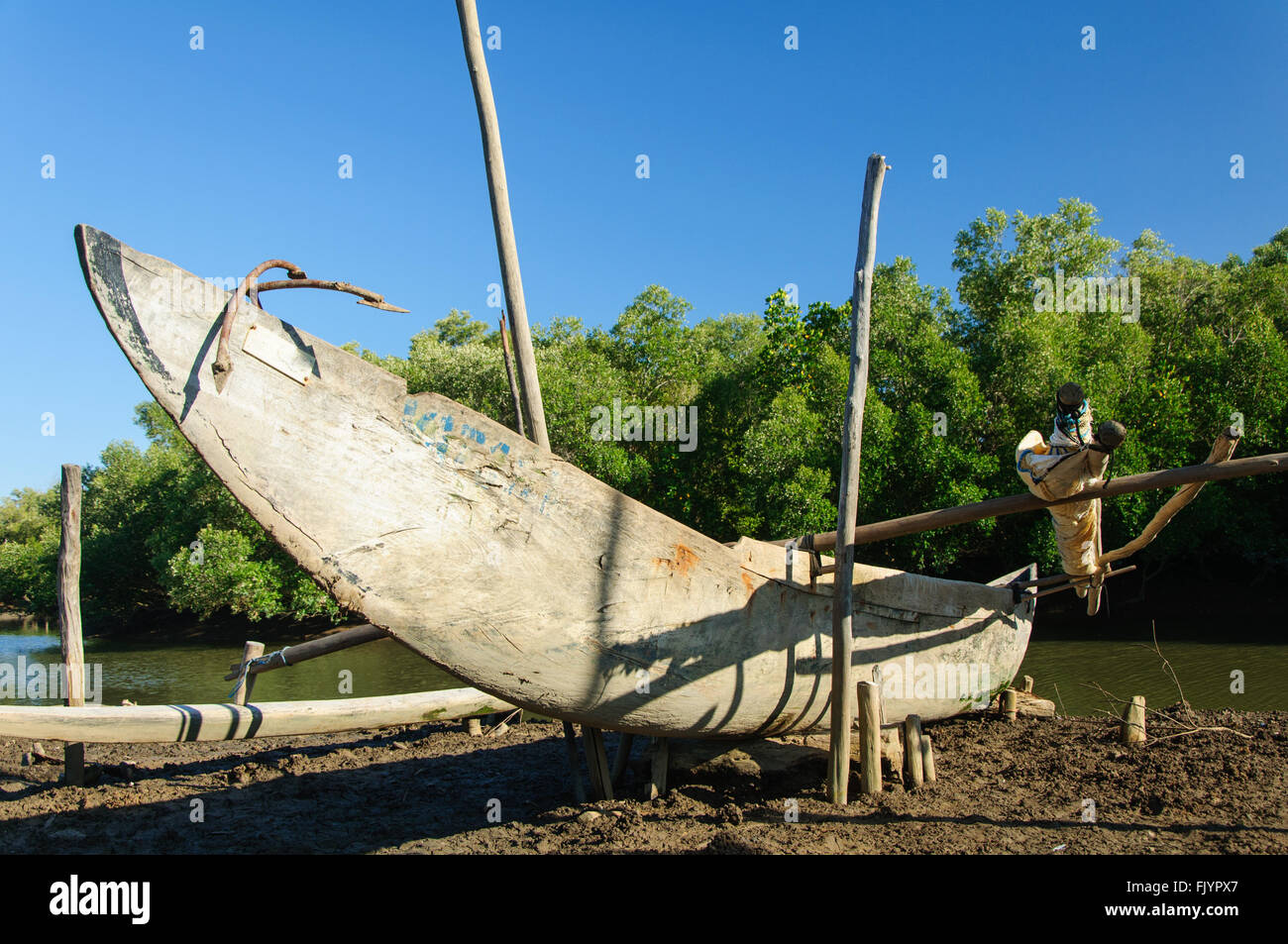 A pirogue ashore in Antsatrana, Northern Madagascar Stock Photo