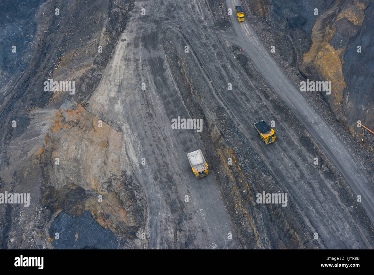 An aerial view of trucks in an opencast coal mine Stock Photo