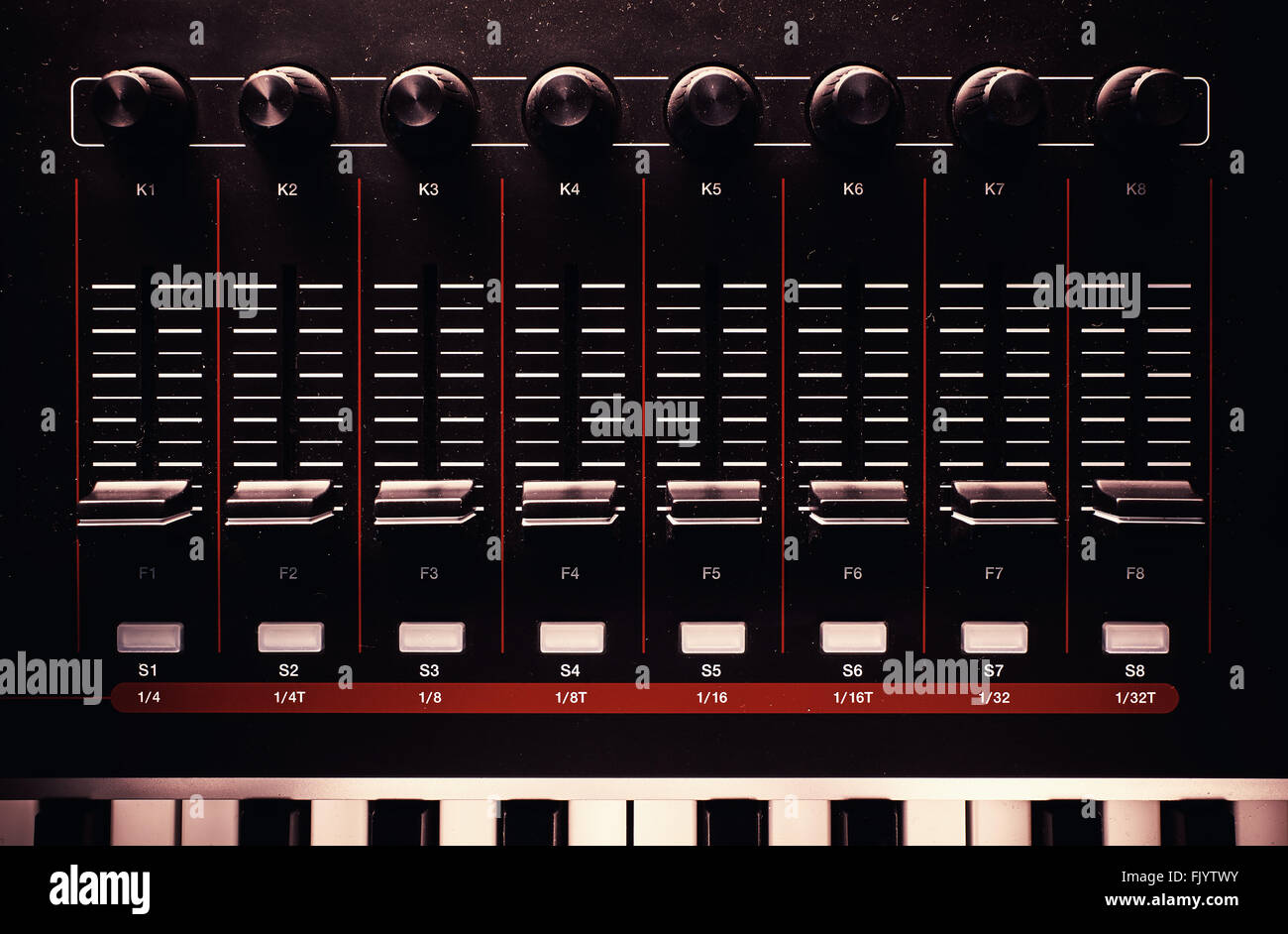 Sliders and knobs of a dusty modern midi controller Stock Photo Alamy