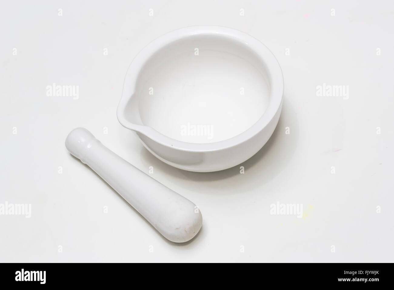 White ceramic mortar and pestle isolated on white background Stock