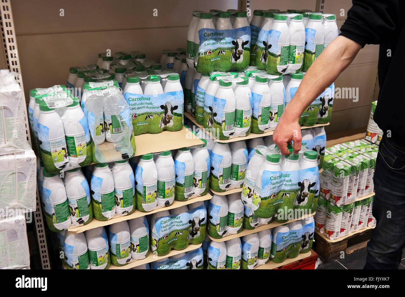 Milk in plastic bottles printed with cows Stock Photo Alamy