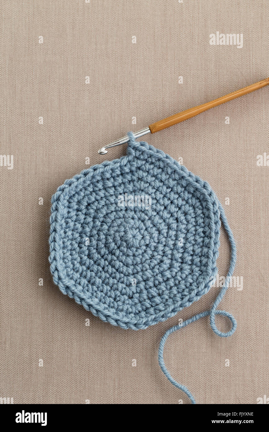 Blue wool with crochet hook Stock Photo