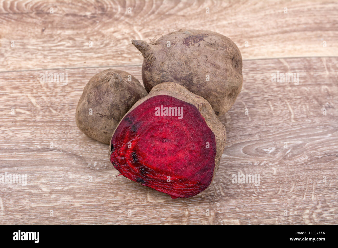 The red beets on a brown wooden background Stock Photo Alamy
