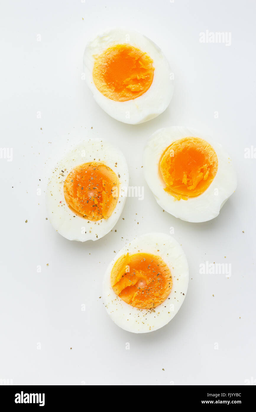 Hard boiled egg halves with pepper Stock Photo