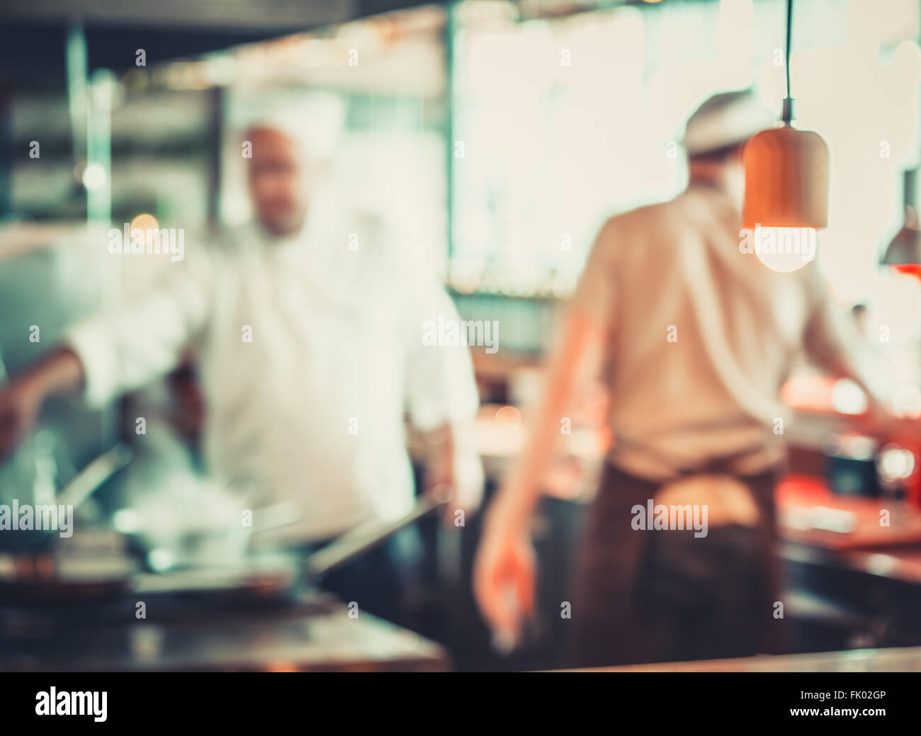 workers cooking in restaurant Stock Photo