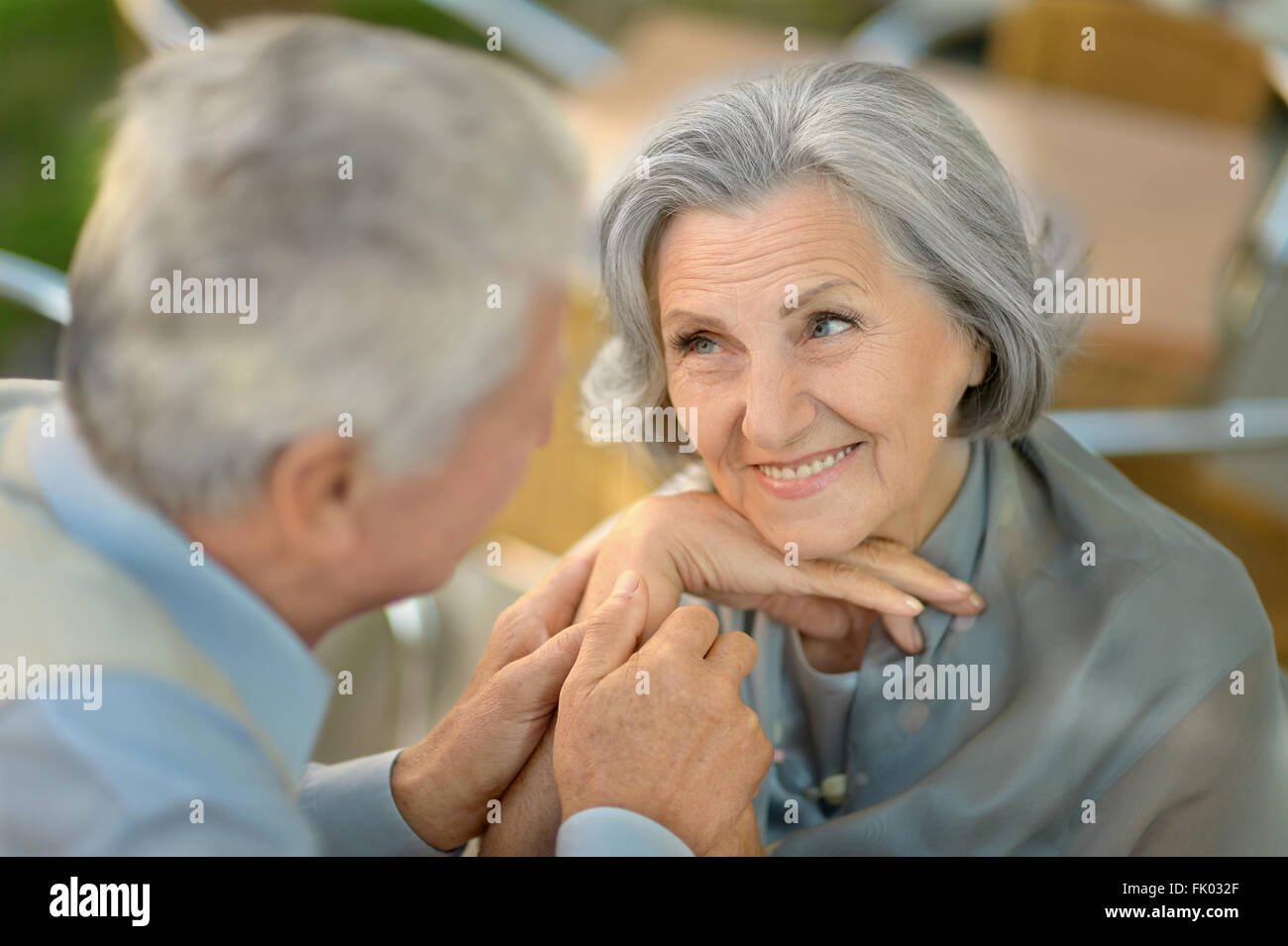 Senior couple sitting Stock Photo - Alamy