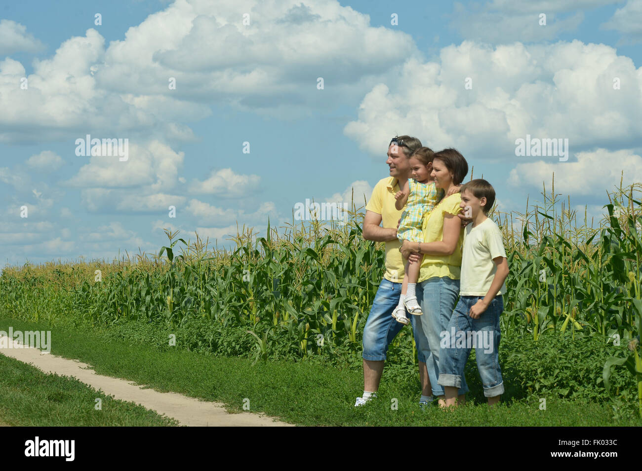 Family standing in field Stock Photo