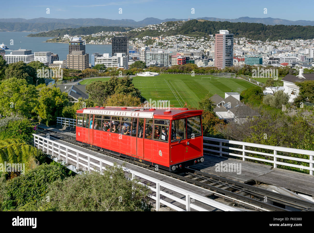 Wellington Cable Car on railway track, funicular railway, harbour and city center behind, Wellinton, New Zealand Stock Photo