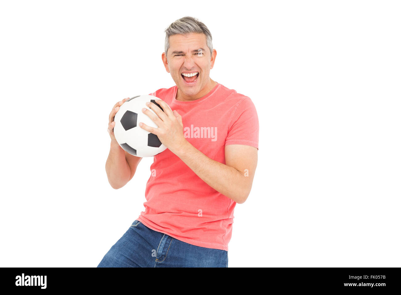 Happy man holding a soccer ball Stock Photo - Alamy
