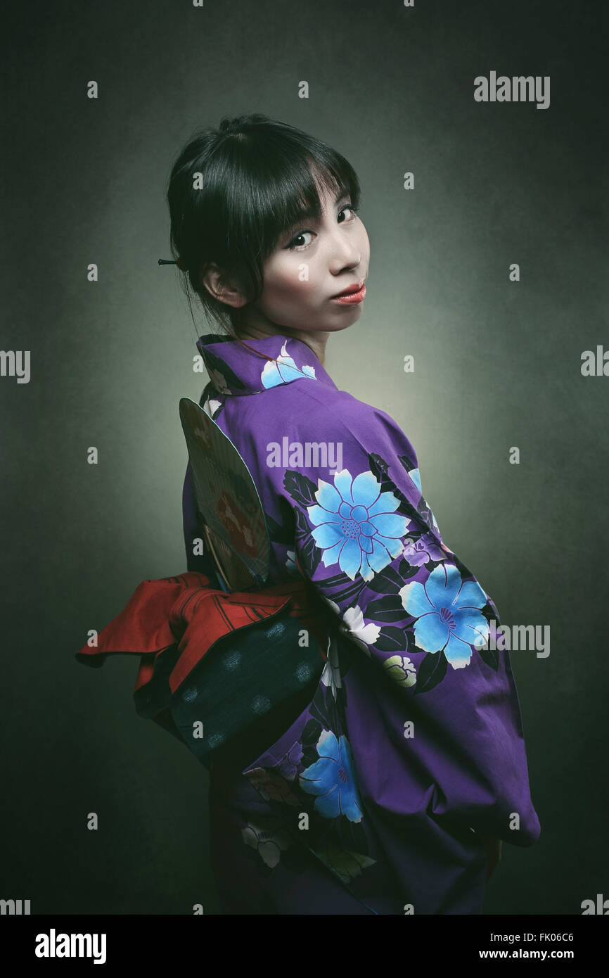Beautiful japanese woman in traditional kimono dress . Studio shot Stock Photo