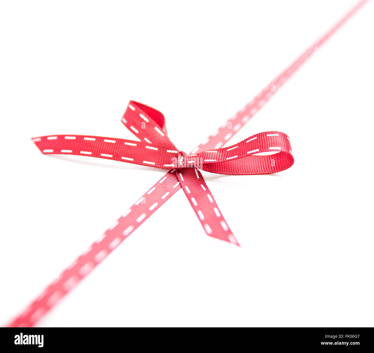 red ribbon and bow isolated on white background Stock Photo - Alamy