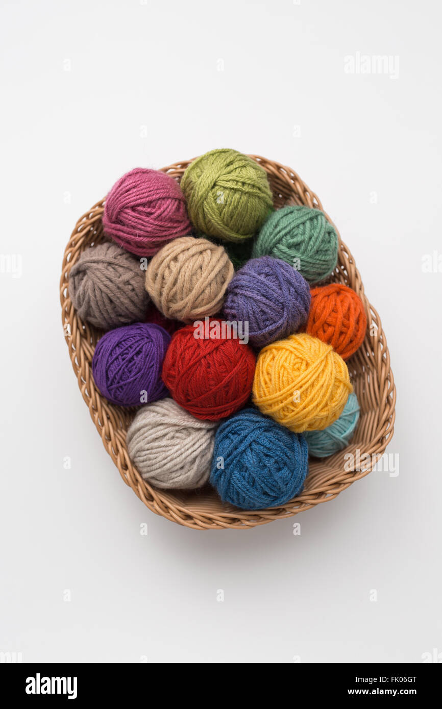 Knitting balls in basket Stock Photo