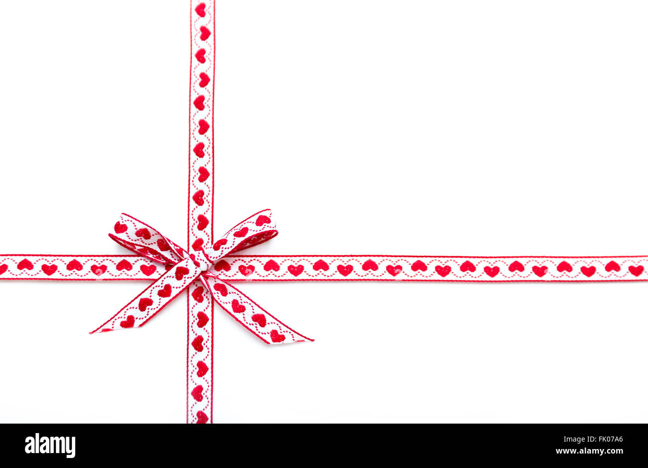 red ribbon and bow isolated on white background Stock Photo - Alamy