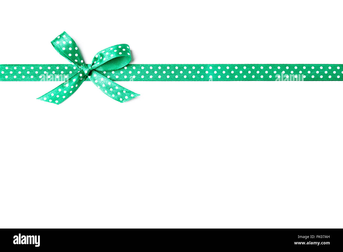 green ribbon with dots isolated on white background, copy space Stock Photo