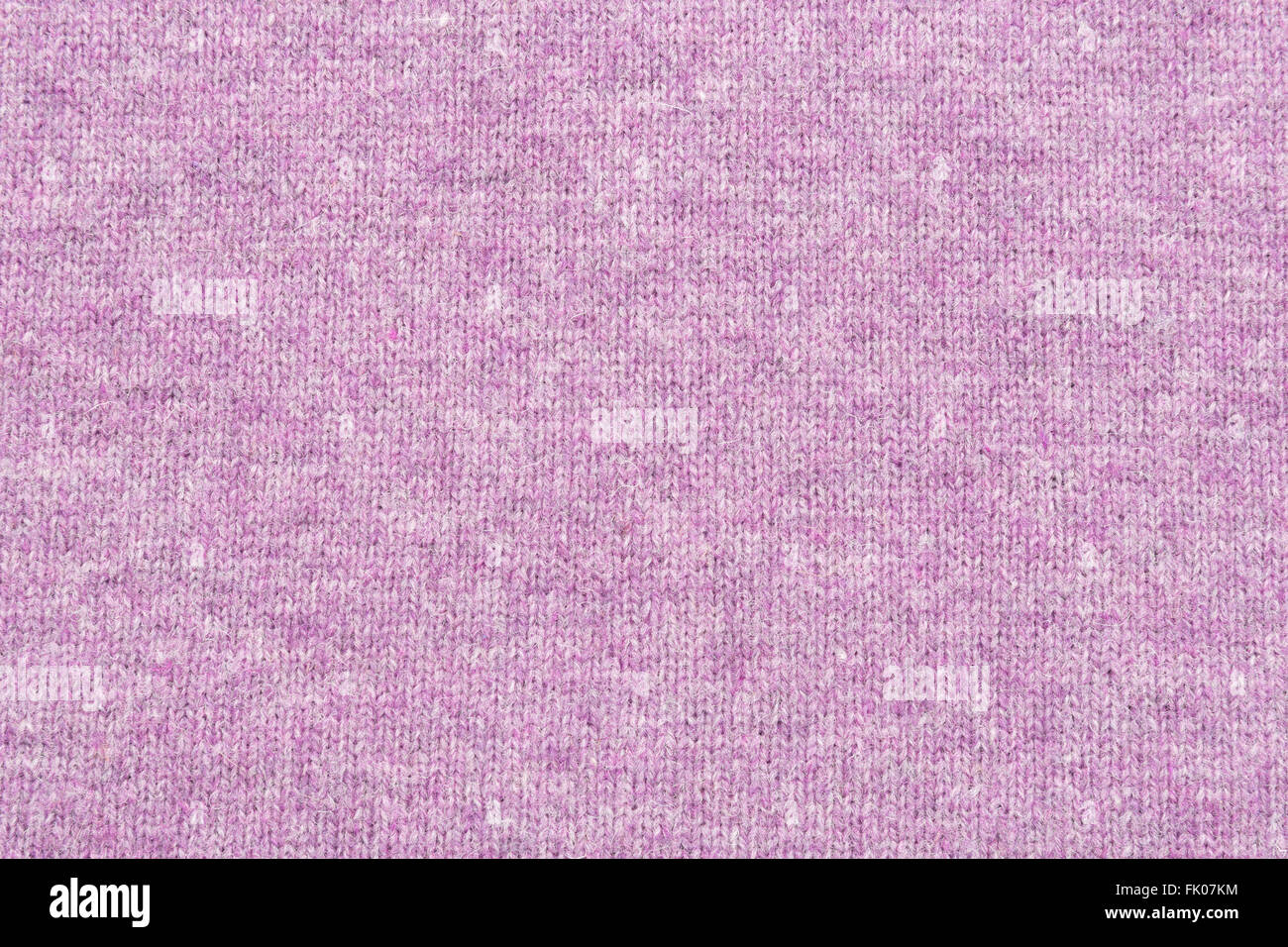 melange purple woolen knitted fabric as background Stock Photo