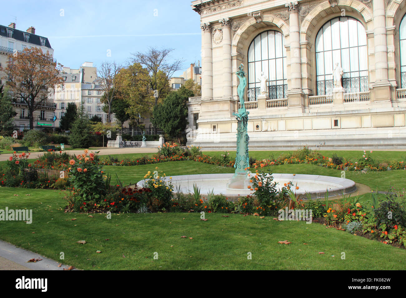 A full of flowers garden and a fountain closed to the Galliera Palace in Paris (France). Stock Photo