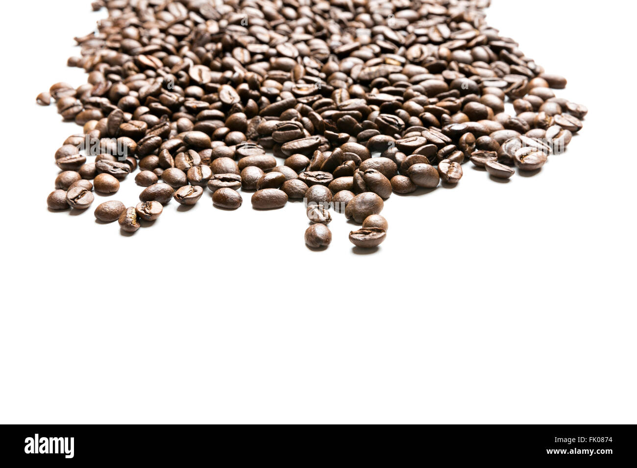 pile of coffee beans isolated on white background Stock Photo - Alamy